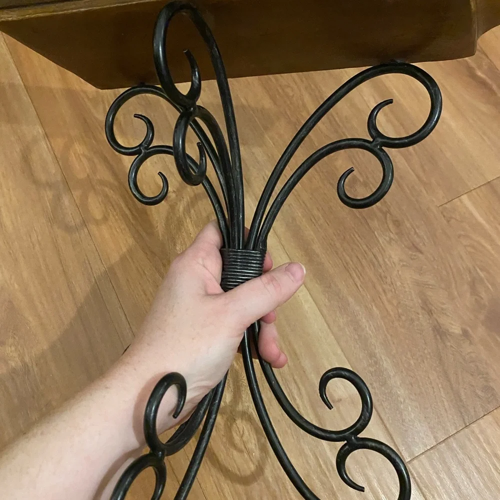 Brown and black iron and wood wall shelf